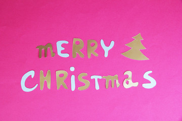 Naklejka na ściany i meble Merry Christmas lettering on pink background
