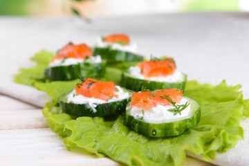 Delicious canapes on table close-up