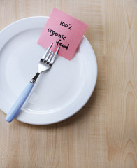 Note paper with message  attached to fork,