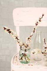 Beautiful apricot blossom in transparent jars
