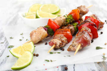 Pork kebab on wooden table close up
