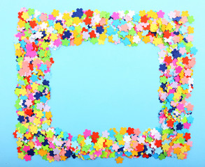 Confetti frame on blue background