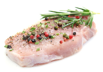 Raw meat steak with spices and herbs isolated on white