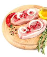 Raw meat steak with herbs, spices, onion rings