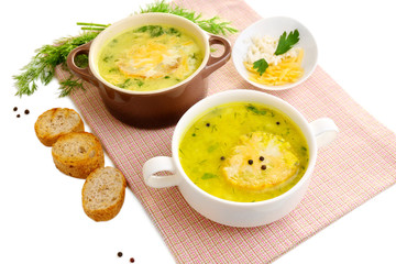 Tasty soup in saucepans, isolated on white