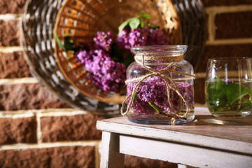 Beautiful lilac flowers in vase,
