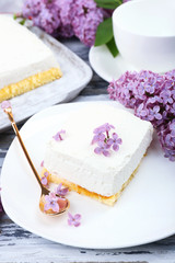 Delicious dessert with lilac flowers