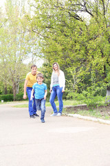 Fototapeta premium Happy family, walk in the park