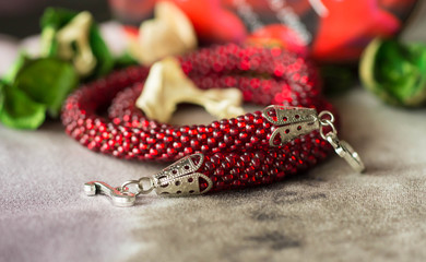 Necklace from red beads close up