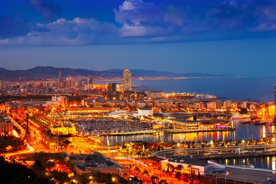Port Vell and cityspace in Barcelona during evening
