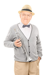 Senior gentleman holding a trumpet