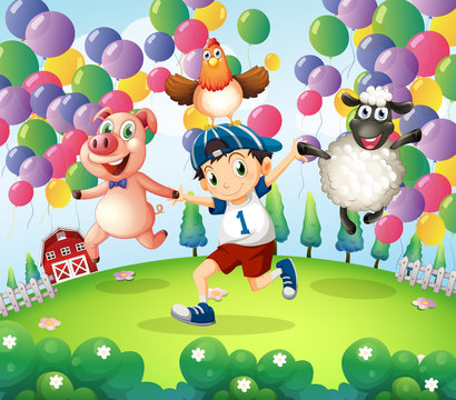 A boy and his animals at the farm with floating balloons