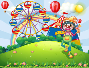 A clown at the hilltop with a carnival