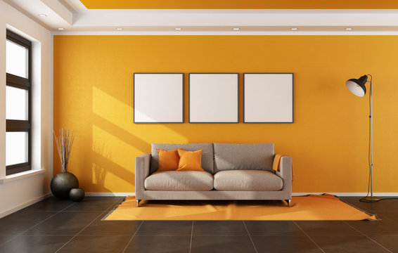 Modern living room with orange wall