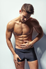 Muscular man whis abdominal pain