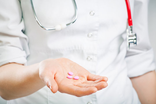 nurse giving pills