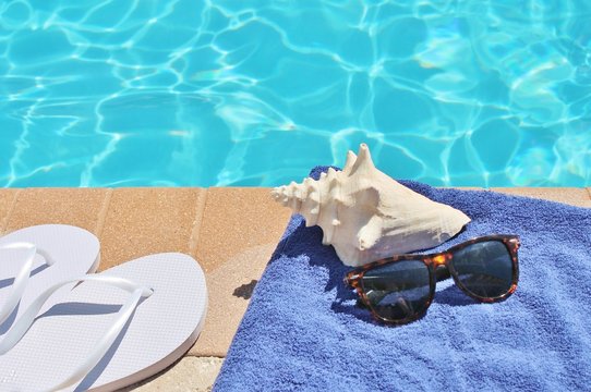 Poolside holiday vacation scenic conch thongs sunglasses background stock, photo, photograph, picture, image