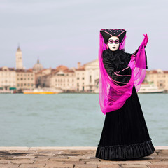 Carnival of Venice, beautiful mask at St. George island with Mar