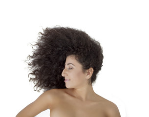 Smiling young female fashion model lying on the floor