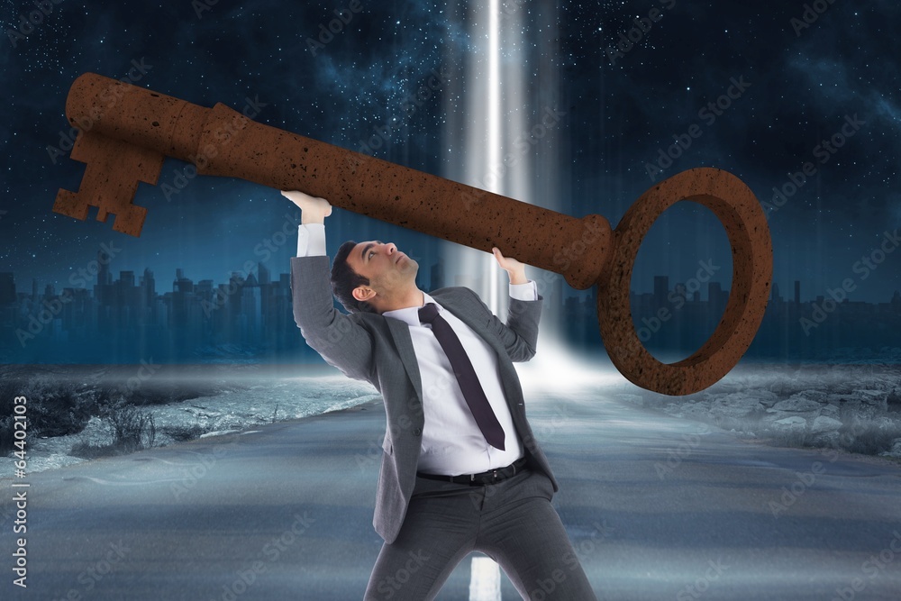 Poster Composite image of unsmiling businessman carrying large key