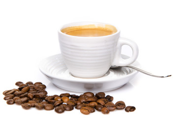 A cup of coffee with coffee beans