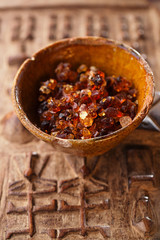 Gum arabic, also known as acacia gum - in bowl