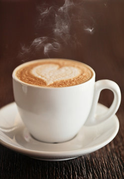 love cup , heart drawing on latte art coffee