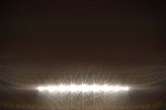 Large football stadium under night sky