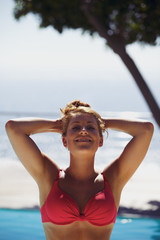 Relaxed young woman in the swimming pool