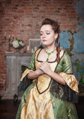 Sad beautiful woman in medieval dress