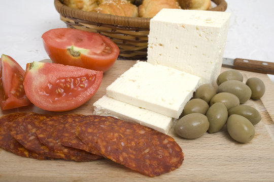 Mediterranean breakfast - Cheese, sausage, tomato and olives on 