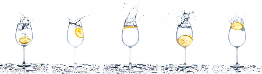 Lemon splashing into glasses of water on white background