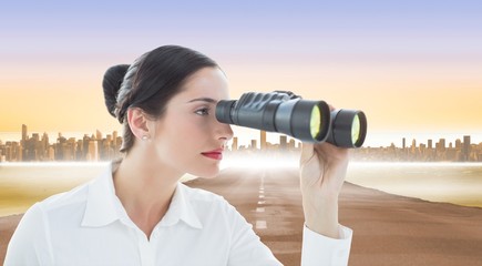 Composite image of business woman looking through binoculars