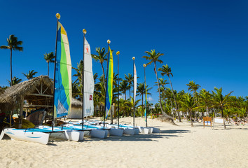 Few sail boats, catamarans, on tropical beach