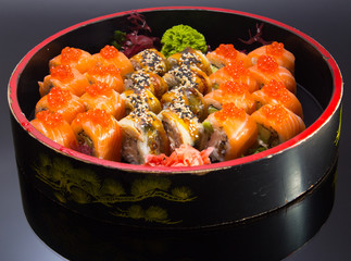 sushi mde dish over black background