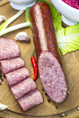 sausage on a wooden plate in a restaurant
