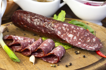 sausage on a wooden plate in a restaurant