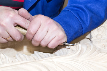 man engaged in woodcarving