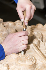 man engaged in woodcarving