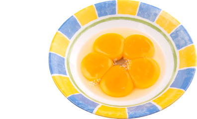 Egg yolk in a ceramic bowl