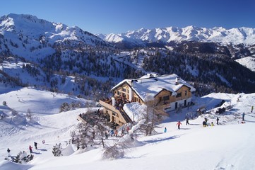 Snowy hut on slopes