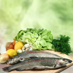 Two fresh trout with vegetables
