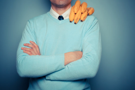 Man with bananas on his shoulder