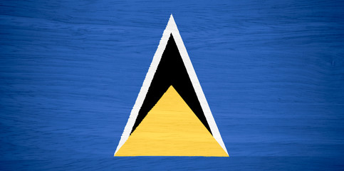 Saint Lucia flag on wood texture