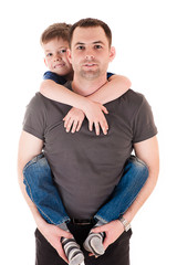 young father with his son on back isolated on white © Ruslan Solntsev