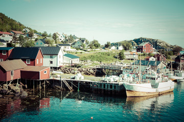 Fototapeta na wymiar Typical Norwegian fishing village with traditional red rorbu hut