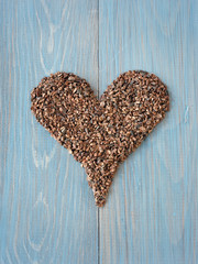 Organic cacao nibs shaped in heart symbol