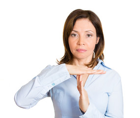 Serious middle aged woman giving time out gesture