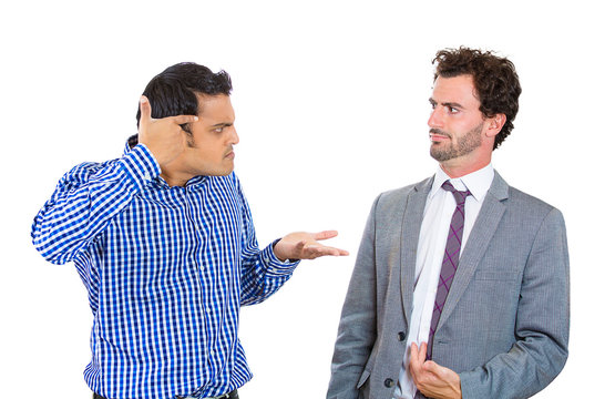 Are you crazy? Two angry men arguing with each other