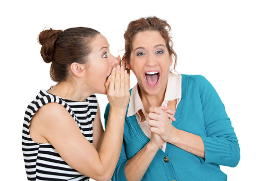 Surprise rumors. Two gossiping women spread latest office story